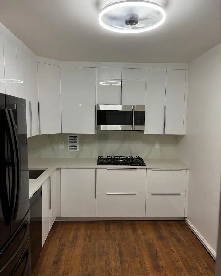 Renovated kitchen with quartz countertops in Gilford